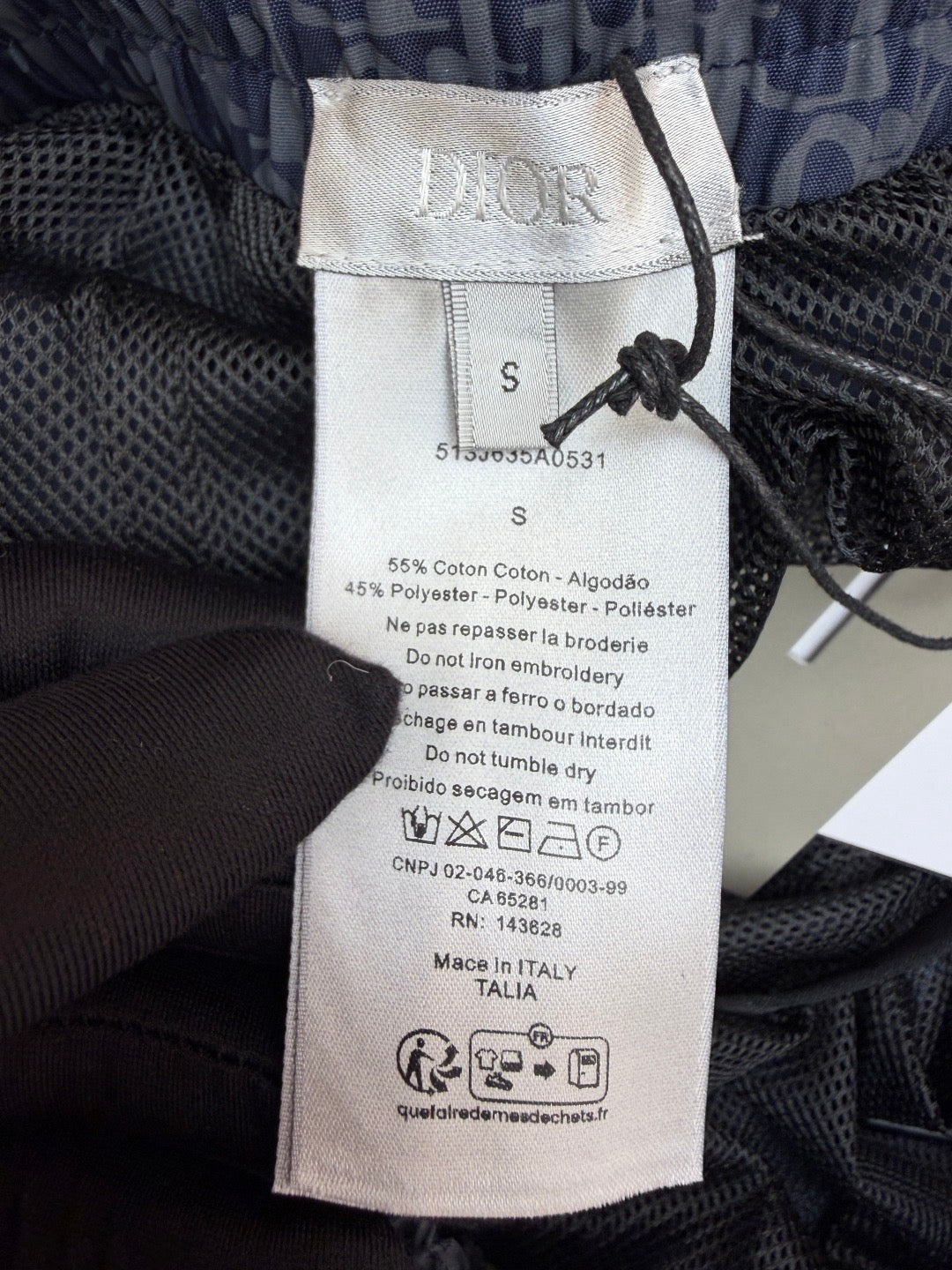 D10r - Short de bain oblique en tissu technique Color Block