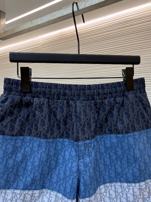 D10r - Short de bain oblique en tissu technique Color Block